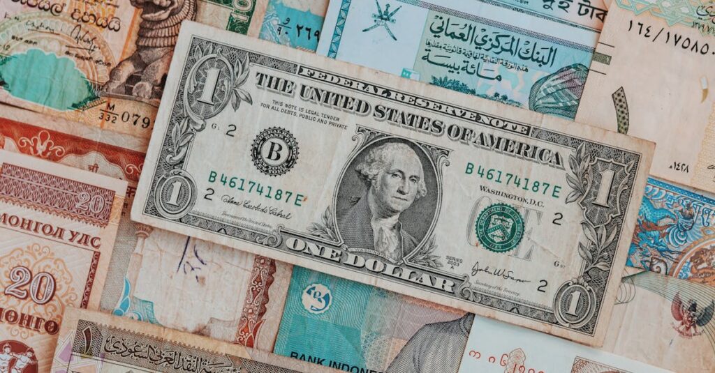 Close-up of various international banknotes creating a diverse currency background.